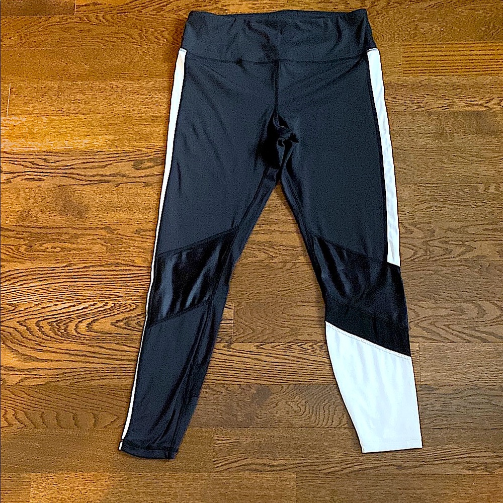 ALALA- Black and White Leggings with mesh & leather accents on the bottom!